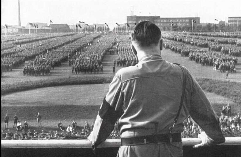 German chancellor Adolf Hitler looks out at a rally staged by the Nazi Party (photo credit: Courtesy)