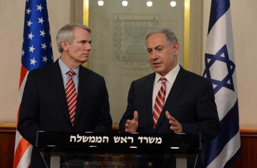 Prime Minister Benjamin Netanyahu meets with Senator Rob Portman (photo credit: HAIM ZACH/GPO)
