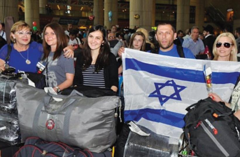 JEWISH IMMIGRANTS from Ukraine arrive at Ben-Gurion Airport in 2012. (photo credit: Courtesy)