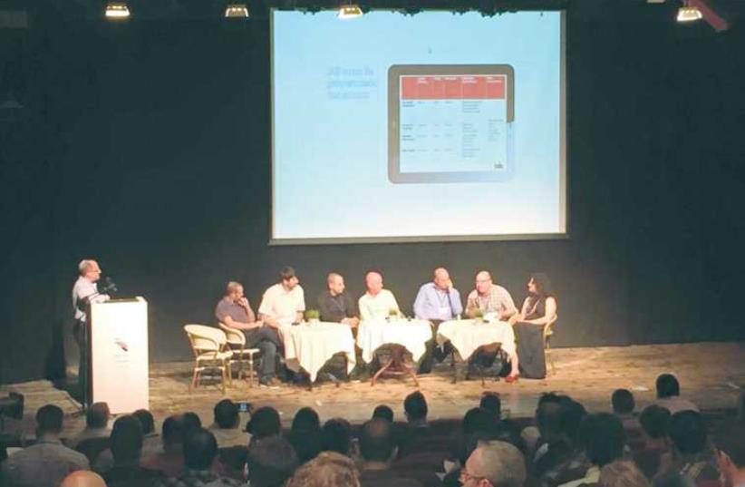 A ROUNDTABLE DISCUSSION of technology experts takes place at the Ad Tech Summit Israel in Jaffa Port’s Nalaga’at Center  (photo credit: ELI MANDELBAUM)