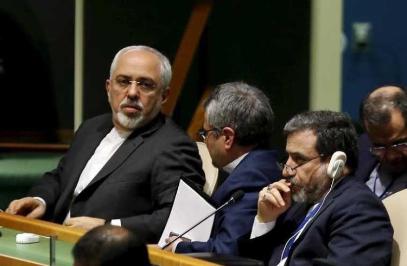 Iranian Foreign Minister Mohammad Javad Zarif (L) sits with the Iranian delegation before addressing the Opening Meeting of the 2015 Review Conference of the Parties to the Treaty on the Non-Proliferation of Nuclear Weapons (NPT) at United Nations headquarters in New York (photo credit: REUTERS)