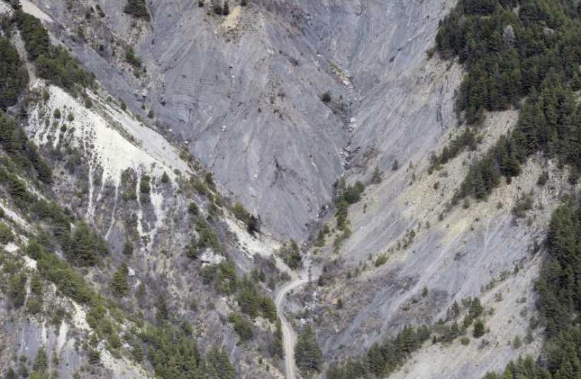An aerial photo taken from a helicopter shows the crash site of the Germanwings Airbus A320 and its debris on the mountainside near Seyne-les-Alpes (photo credit: REUTERS)