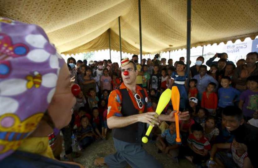 Medical clowns perform in front of children affected by earthquake in Kathmandu. (photo credit: REUTERS)