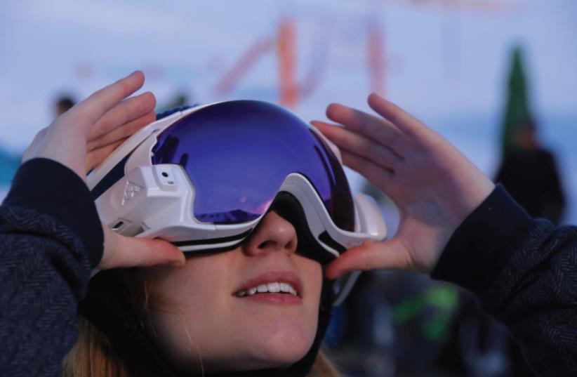 RIDEON’S ADDITION for ski goggles lets skiers access maps, play music, chat with friends and play interactive games (photo credit: Courtesy)