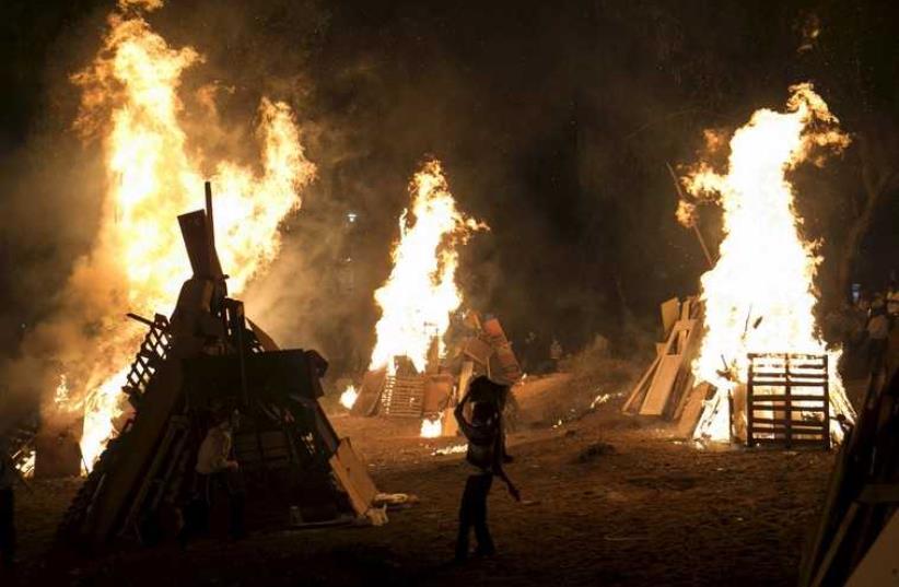 A bonfire during Lag Ba'omer festivities in Bnei Brak  (photo credit: REUTERS)