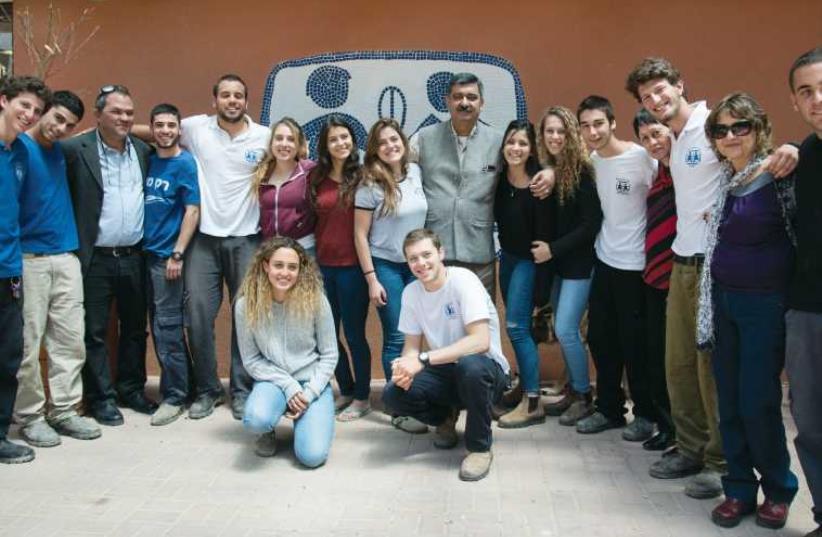 Siddartha Kaul (center) with staff and students at Kfar Neradim. (photo credit: KATERINA ILIEVSKA)