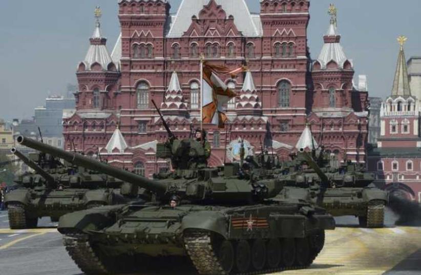 Russian T-90A main battle tanks drive during the Victory Day parade at Red Square in Moscow (photo credit: REUTERS)