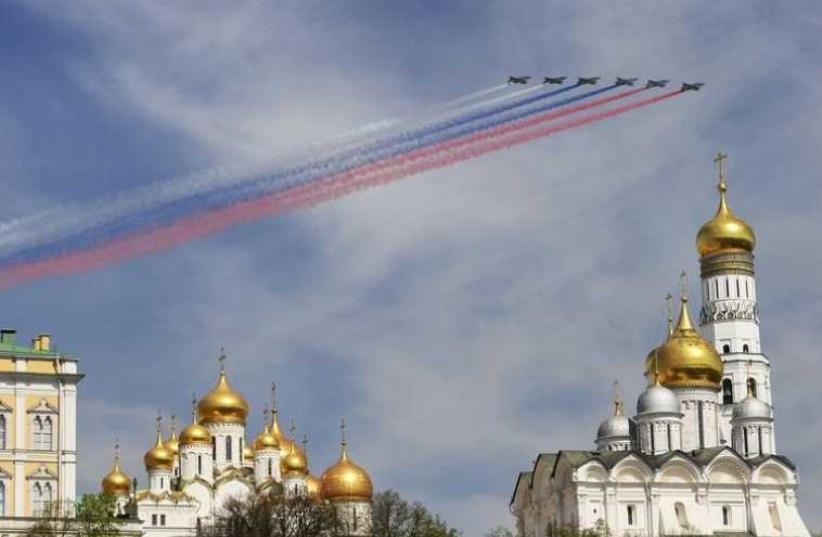 Russian Sukhoi Su-25 Frogfoot ground-attack planes fly in formation over the Red Square during the Victory Day parade in Moscow (photo credit: REUTERS)