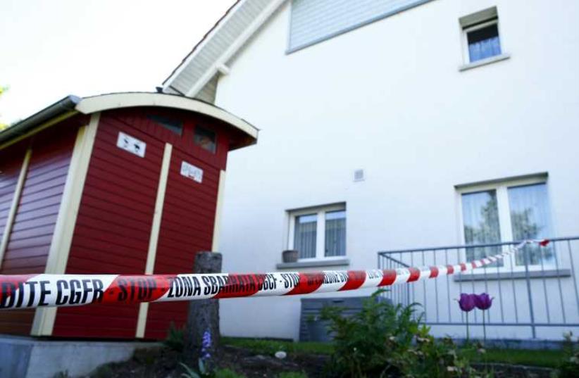A police ribbon is seen in front of a house in Wuerenlingen, Switzerland May 10, 2015. (photo credit: REUTERS)