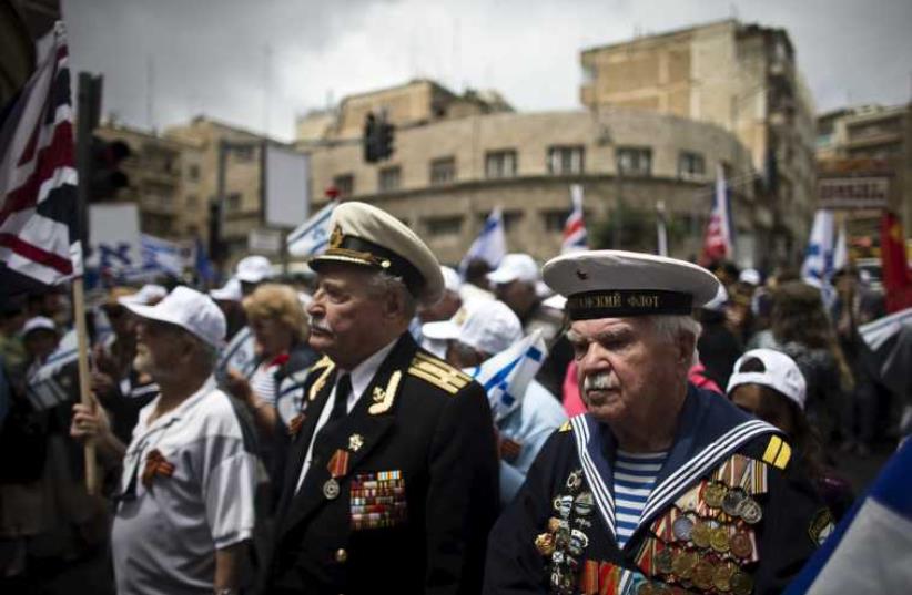 Veterans march through Jerusalem to mark WW2 Victory in Europe Day. (photo credit: REUTERS)