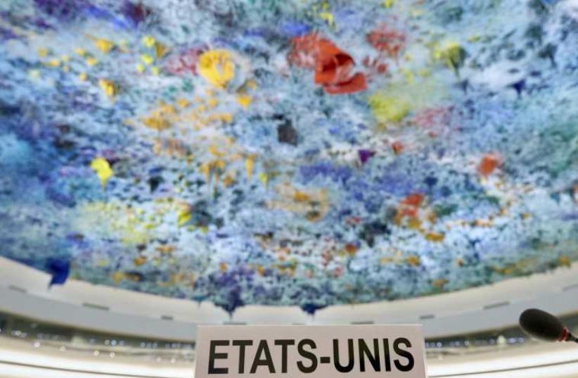 The name sign for the United States is positioned on the podium before the start of the Universal Periodic Review of the US at the United Nations European headquarters in Geneva, May 11 (photo credit: REUTERS)