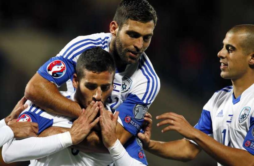 Israel's Tomer Hemed (L), Itay Shechter (C) and Tal Ben Chaim celebrate a goal against Andorra during their Euro 2016 qualification soccer match  (photo credit: REUTERS)