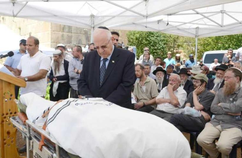 President Rueven Rivlin attends the funeral of Moshe Levinger (photo credit: Mark Neiman/GPO)