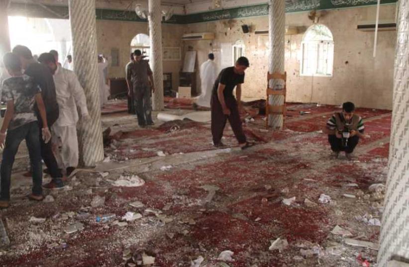 Suicide bomb attack scene at the Imam Ali mosque in Saudi Arabia's eastern province of Gatif, May 22, 2015.  (photo credit: REUTERS)