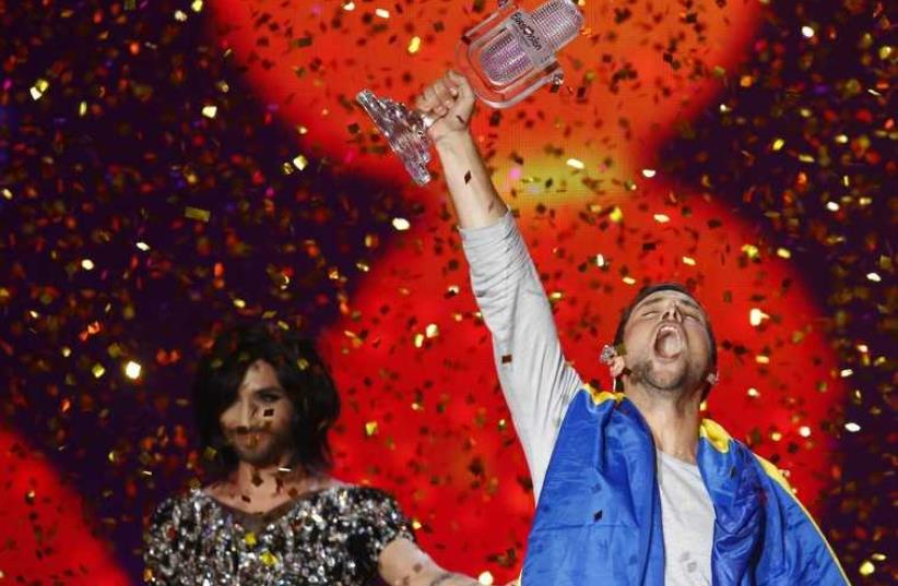 Singer Mans Zelmerloew representing Sweden celebrates winning the final of the 60th annual Eurovision Song Contest in Vienna, Austria May 23 (photo credit: REUTERS)