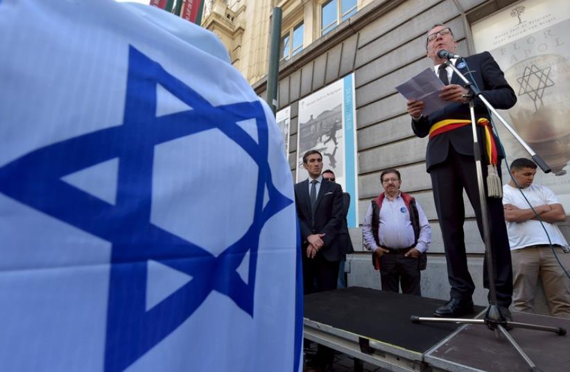 Brussels' Mayor Yvan Mayeur gives a speech during a ceremony for the victims of the May 24, 2014 attack at the entrance of the Jewish Museum in Brussels, Belgium May 24 (photo credit: REUTERS)