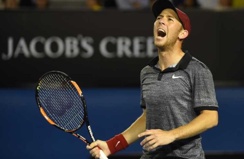 Dudi Sela shouts during his men's singles match against Spain's Rafael Nadal on day five of the 2015 Australian Open tennis tournament in Melbourne on January 23, 2015.  (photo credit: MAL FAIRCLOUGH / AFP)