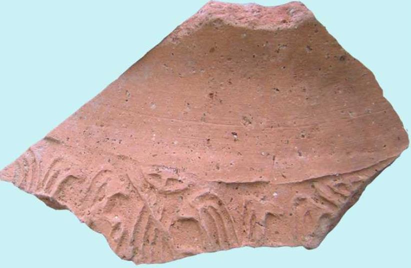 An image of a fragment of the cylinder seal impression that was found at the Bet Ha-Emeq antiquities site on which a music scene is depicted. (photo credit: COURTESY OF NIMROD GETZOV AND IAA)
