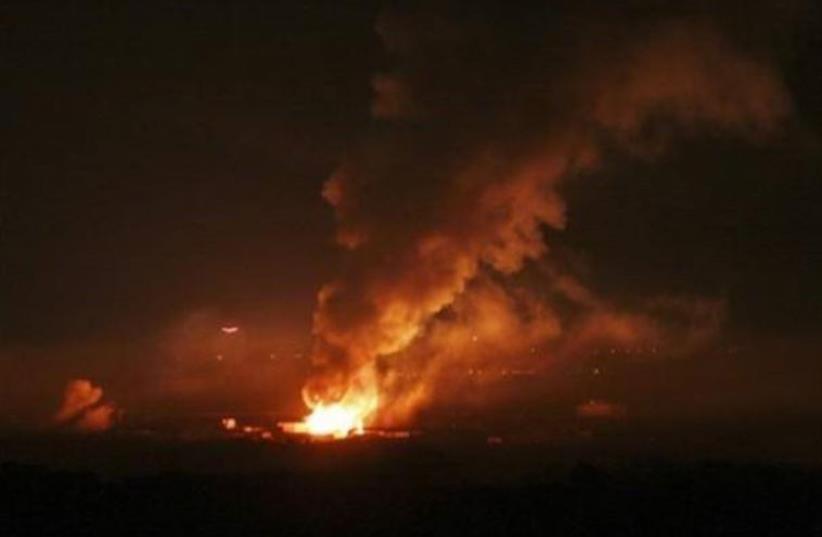 Explosions in Gaza following IDF attack (photo credit: PALESTINIAN MEDIA)
