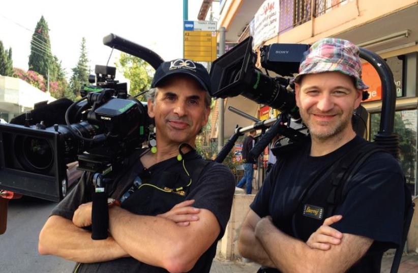ROGER SHERMAN (left) and Anthony Savini film nearby Ma’alot Tarshiha. (photo credit: FLORENTINE FILMS)