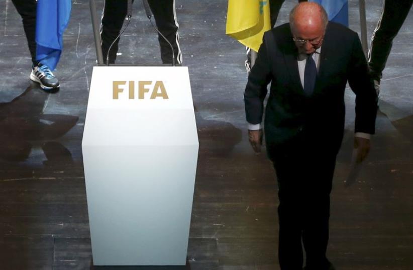 FIFA President Sepp Blatter leaves the stage after making a speech during the opening ceremony of the 65th FIFA Congress in Zurich, Switzerland (photo credit: REUTERS)