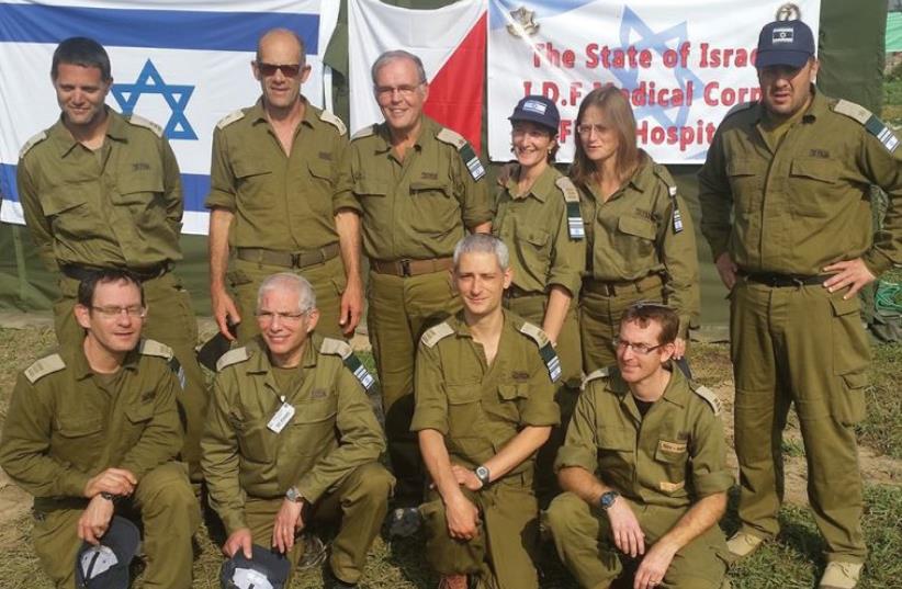 Dr. Ofer Merin (top, second from left) and Prof. Jonathan Halevy next to him; Prof. Amos Peyser (bottom row, second from left)  (photo credit: SHAARE ZEDEK MEDICAL CENTER)