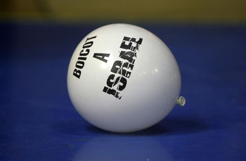 A balloon with the phrase "Boycott to Israel" is seen during a Euroleague basketball game between Maccabi Tel Aviv and Barcelona in Barcelona  (photo credit: REUTERS)