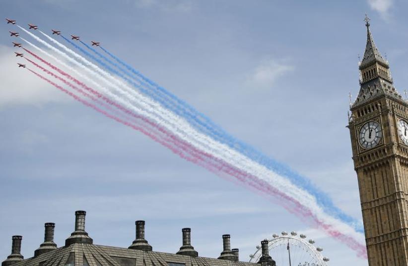 The Red Arrows perform a flypast during an armed forces and veterans' parade on the final day of 70th anniversary Victory in Europe (VE) day commemorations in central London (photo credit: REUTERS)