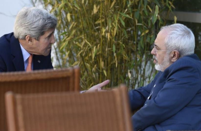 US Secretary of State John Kerry (L) talks with Iranian Foreign Minister Mohammad Javad Zarif on May 30, 2015 in Geneva (photo credit: AFP PHOTO / POOL / SUSAN WALSH)