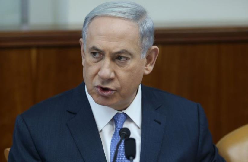 Prime Minister Benjamin Netanyahu at the weekly cabinet meeting on Sunday (photo credit: AMIT SHABAY/POOL)