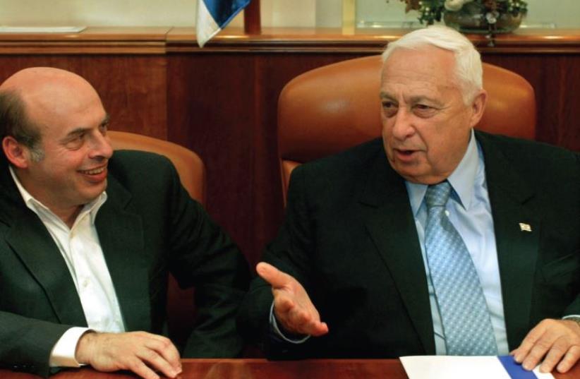 Natan Sharansky in talks merging his Yisrael B’Aliyah party with the Likud of then prime minister, the late Ariel Sharon, in 2003. (photo credit: GILI COHEN MAGEN/REUTERS)