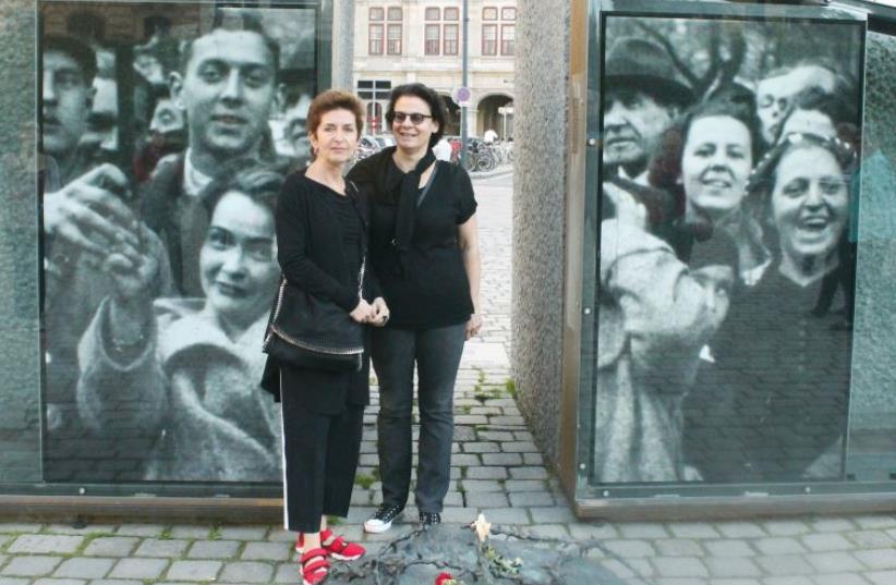 Ruth Beckerman (left) stands in front of her art installation, ‘The Missing Image. (photo credit: BARRY DAVIS)