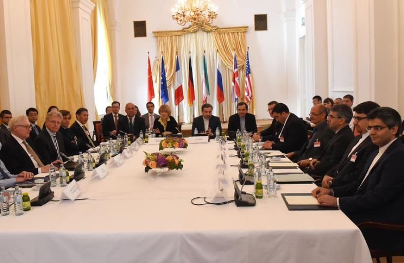 Representatives of EU, US, Britain, France, Russia, Germany, China and Iran meet for another round of the P5+1 powers and Iran talks in Vienna, Austria on June 12, 2015. (photo credit: AFP PHOTO/JOE KLAMAR)