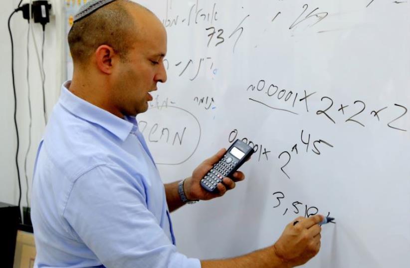 Education Minister Naftali Bennett teaching math to students in Petah Tikva, May 28. (photo credit: COURTESY EDUCATION MINISTRY)