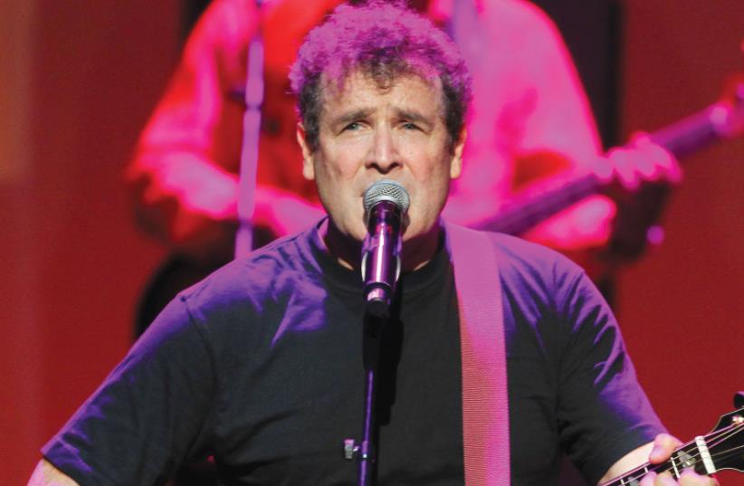 SOUTH AFRICAN singer Johnny Clegg performs during the South Africa Gala night at the Monte Carlo opera in 2012. (photo credit: SEBASTIEN NOGIER/REUTERS)