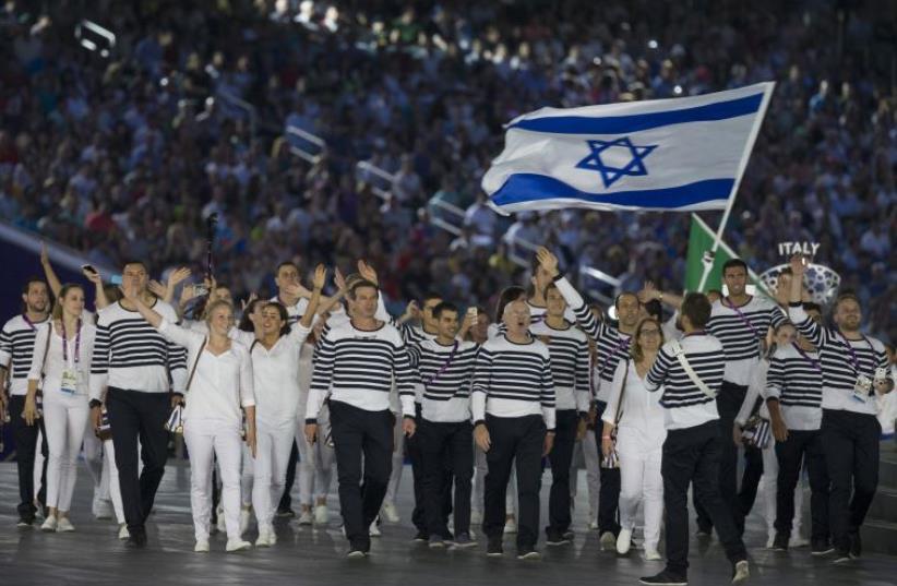 Members of the Israeli delegation parade during the Opening Ceremony of the 2015 European Games at the Olympic Stadium in Baku (photo credit: JACK GUEZ / AFP)