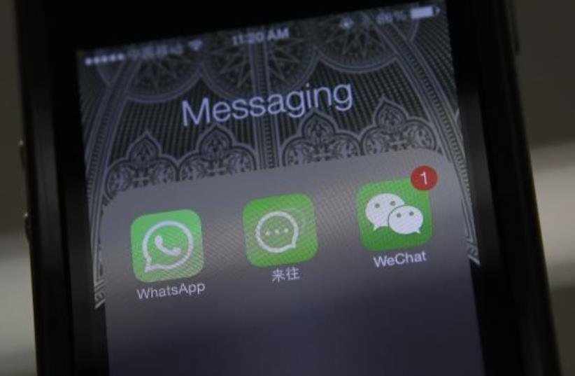 Icons of messaging applications WhatsApp of Facebook (L), Laiwang of Alibaba Group (C) and WeChat, or Weixin, of Tencent Group (photo credit: REUTERS)