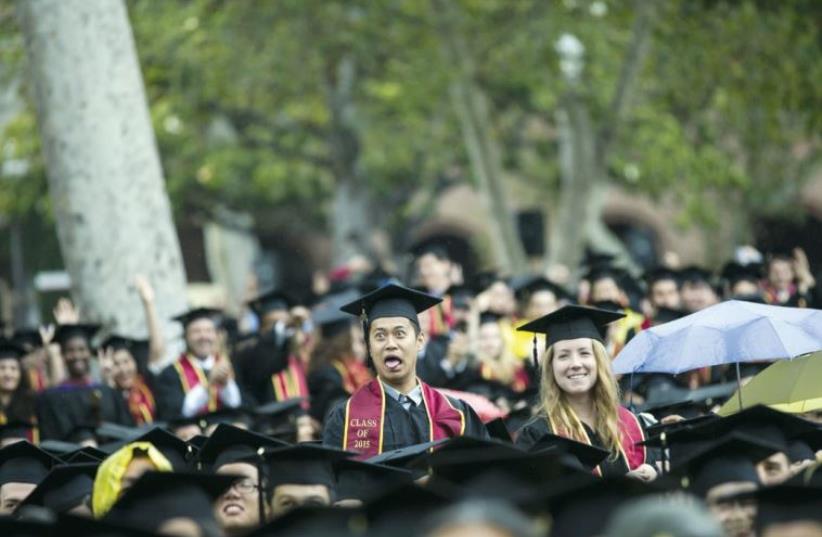 Graduating students walk to their seats during USC’s Commencement Ceremony at University of Southern California in Los Angeles, California May 15, 2015. (photo credit: MARIO ANZUONI/REUTERS)
