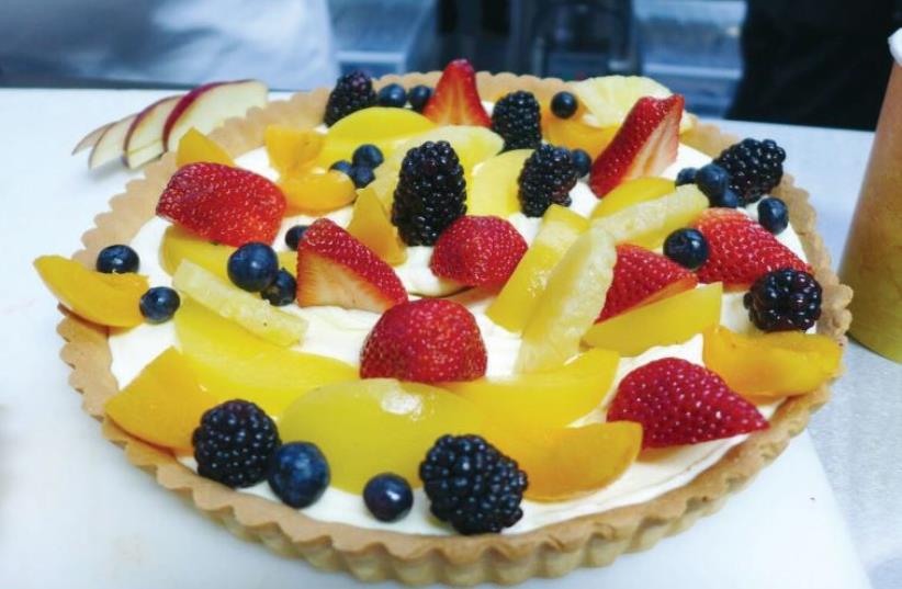 A fruit tart made with French sweet pie pastry and filled with pastry cream. (photo credit: YAKIR LEVY)