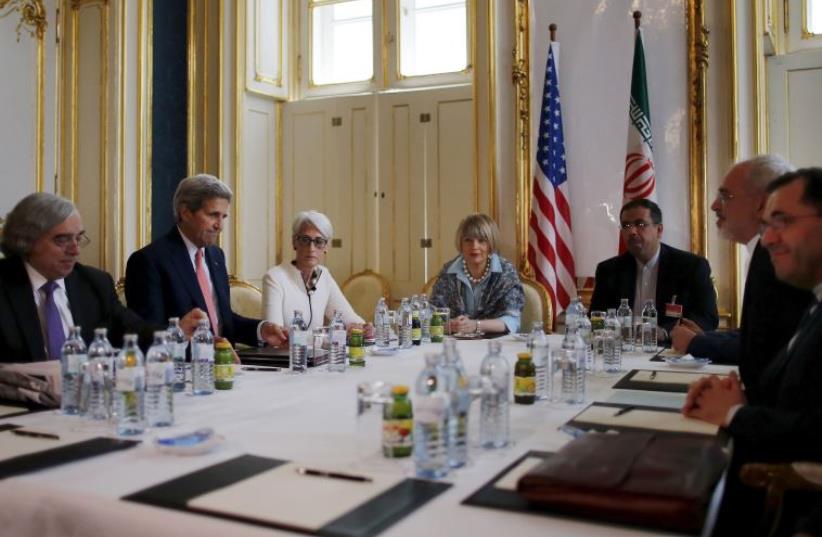 US Secretary of State John Kerry (2nd L) meets with Iranian Foreign Minister Mohammad Javad Zarif (2nd R) at a hotel in Vienna, Austria June 27, 2015.  (photo credit: REUTERS)