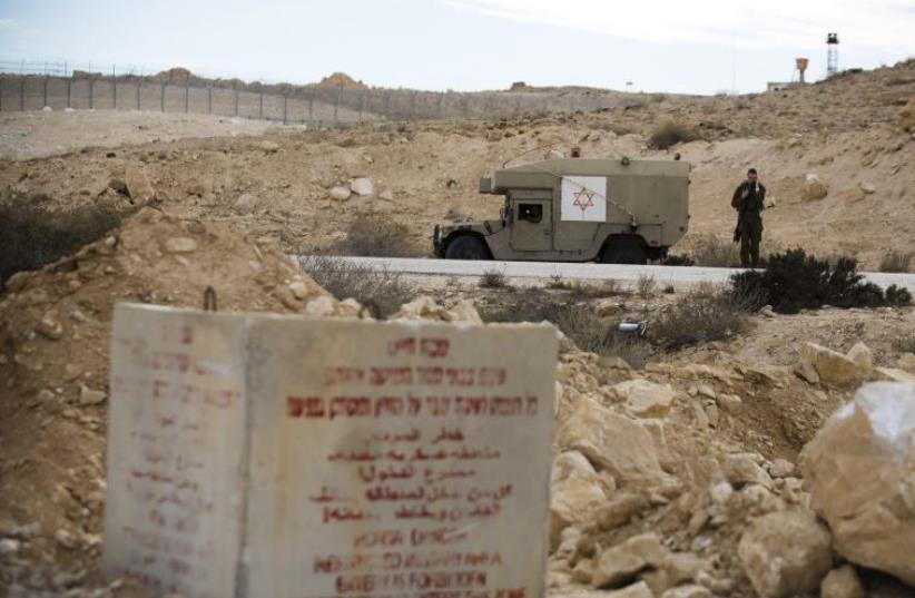 An IDF soldier near the border fence between Israel and Egypt.  (photo credit: REUTERS)