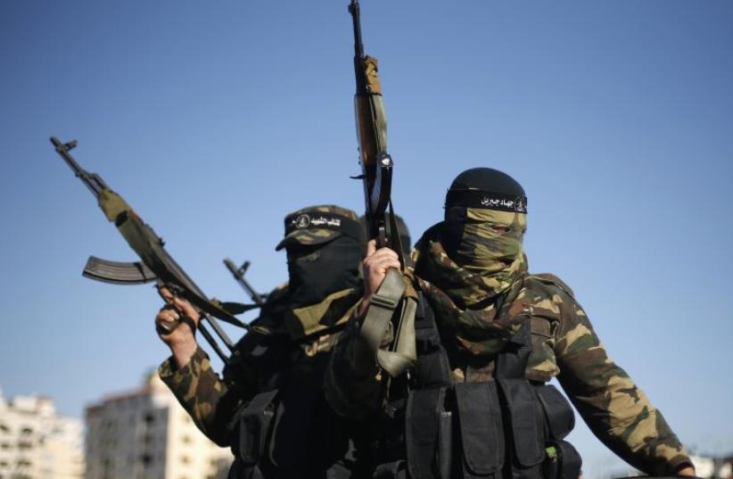 Palestinians militants rally in Gaza City (photo credit: REUTERS)