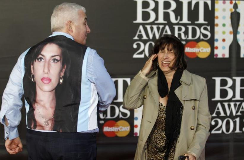 Mitch and Janis Winehouse, the father and mother of the late singer Amy Winehouse (photo credit: REUTERS)