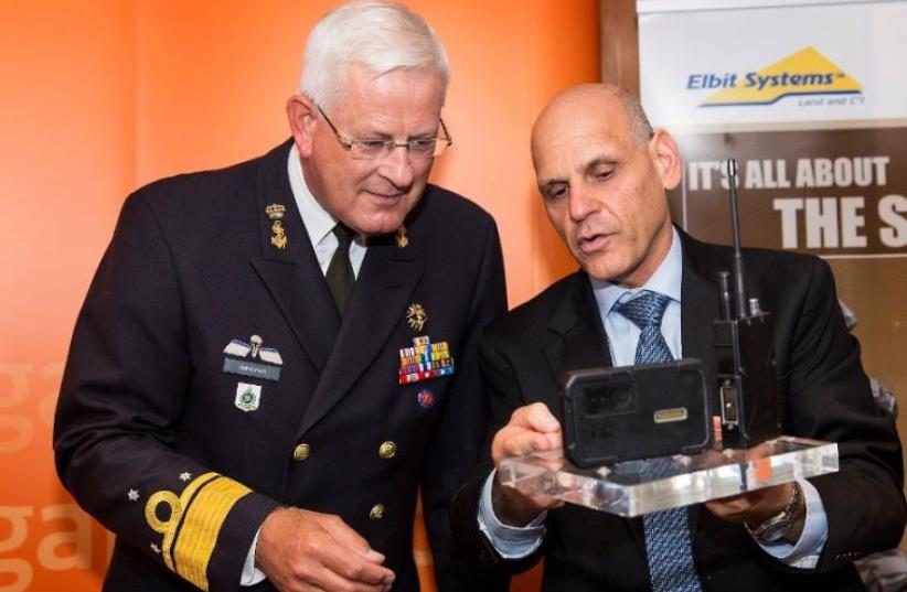 (Left) Vice Admiral Barsboom NL Director DMO with Butzi Machlis Elbit CEO and President(Right) (photo credit: ELBIT SYSTEMS,ELBIT PR)