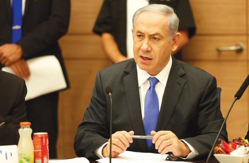 Prime Minister Benjamin Netanyahu speaks at a Likud faction meeting (photo credit: MARC ISRAEL SELLEM/THE JERUSALEM POST)