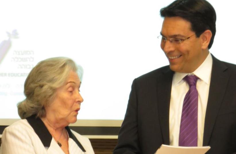 Prof. Ruth Arnon presenting report to Science, Technology and Space Minister Danny Danon (photo credit: JUDY SIEGEL-ITZKOVICH)