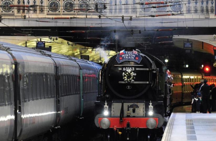 THE WINTON train arrives at Liverpool Street station in central London in 2009. The historical train departed from Prague last week to re-trace the original route to London with several survivors and descendants of 669 so-called ‘Winton’s children’ on board who were rescued by Sir Nicholas Winton in (photo credit: REUTERS)