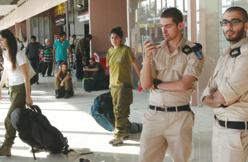 Soldiers at the Beersheba Central Bus Station. (photo credit: ILLUSTRATIVE: MARC ISRAEL SELLEM)