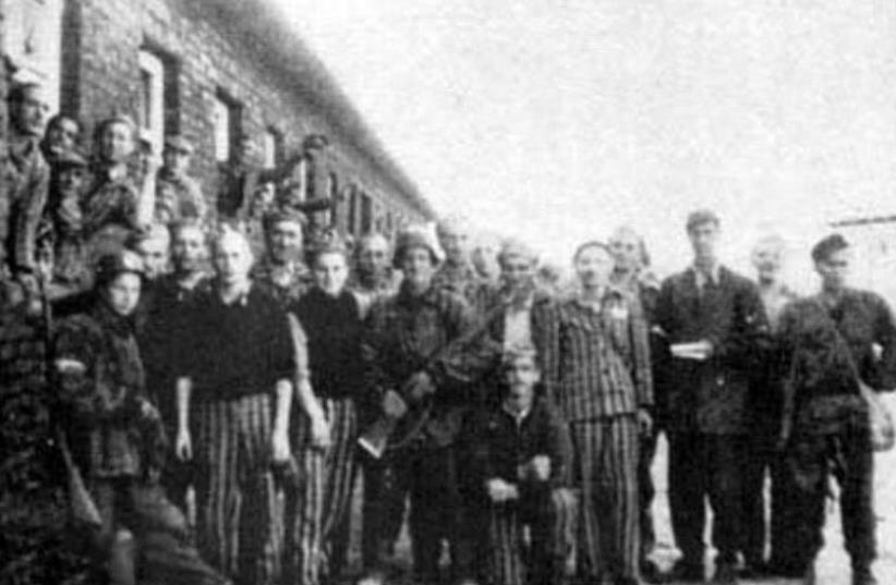Jewish prisoners of Gęsiowka, a German-Nazi Camp in Warsaw liberated in August 5, 1944 with Polish soldiers from Battalion "Zośka" of Home Army in the beginning of Warsaw Uprising (photo credit: WIKIMEDIA COMMONS/POLAND 1944)