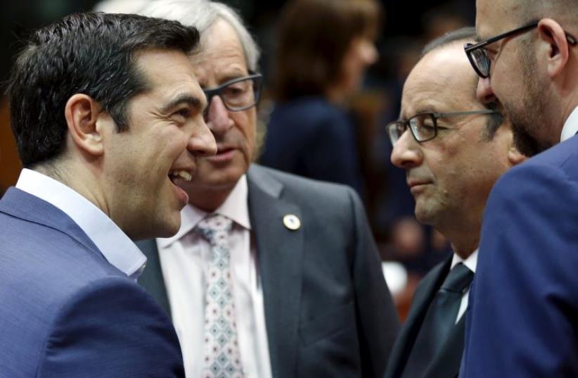 (L-R) Greece's Prime Minister Alexis Tsipras, European Commission President Jean-Claude Juncker, France's President Francois Hollande and Belgium's Prime Minister Charles Michel attend an euro zone leaders summit in Brussels, Belgium. (photo credit: REUTERS)